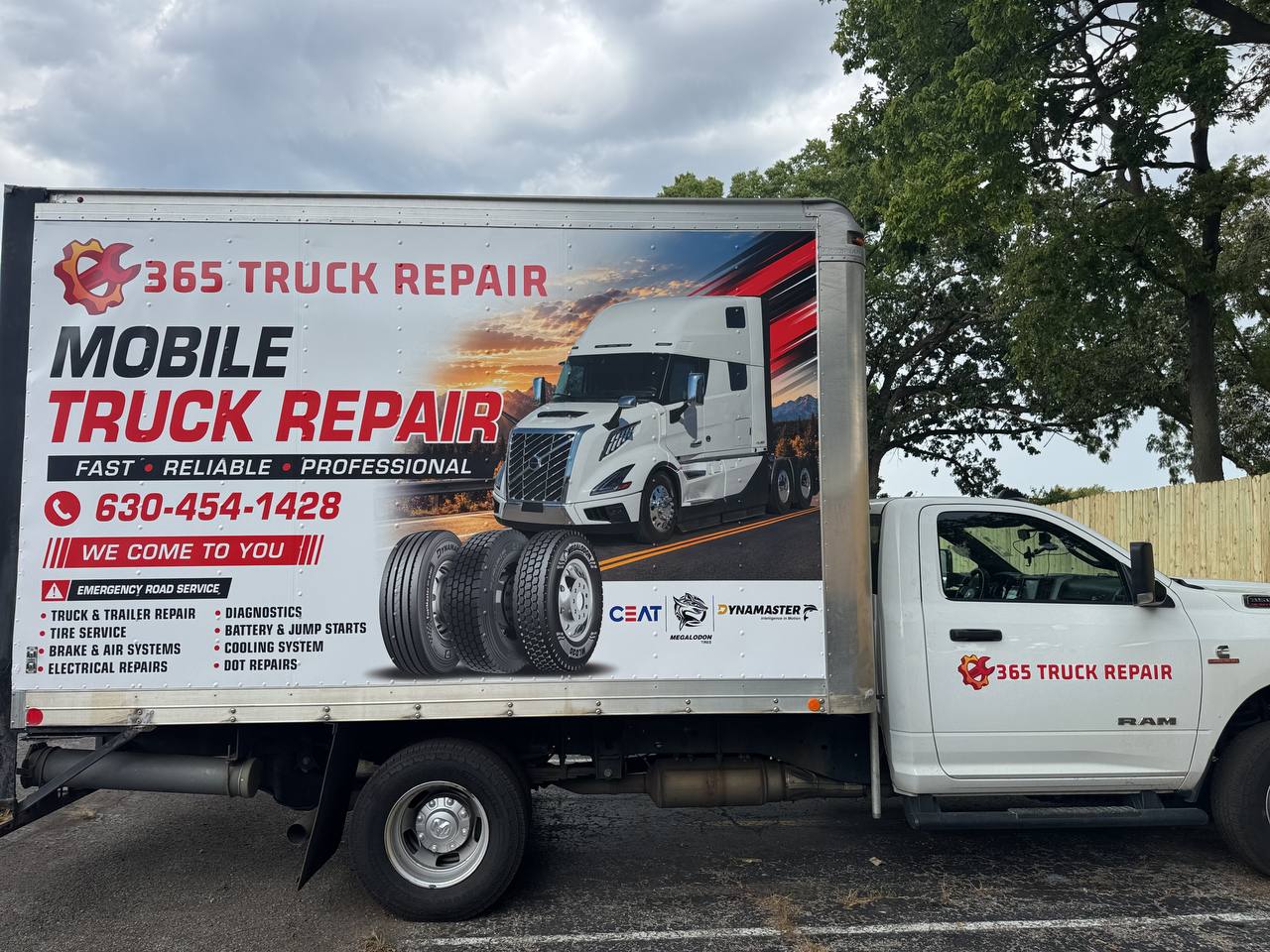 Side view of the 365 Truck Repair mobile unit displaying tire, brake, electrical and diagnostic services